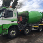 Truck mixer with hydraulic drive system visible