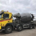 Concrete pouring from truck mixer drum