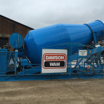 Large truck mixer delivering concrete to site
