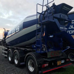 Rear view of concrete truck mixer at depot